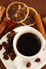 Cup of coffee on brown background