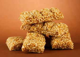 tasty sweets (kozinaki), on brown background
