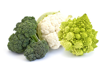 Fresh uncooked broccoli, cauliflower and romanesco on white