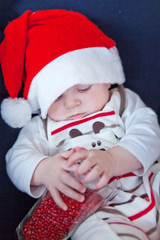 Little baby boy in red Christmas cap