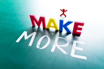 I make more concept, words on blackboard