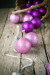 Fototapeta na wymiar Colorful Brilliant Christmas Balls on Wooden Table