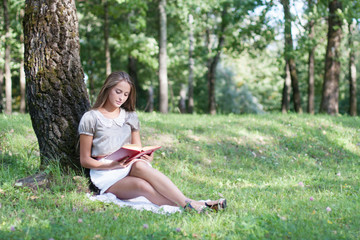 beautiful girl with book outdoor