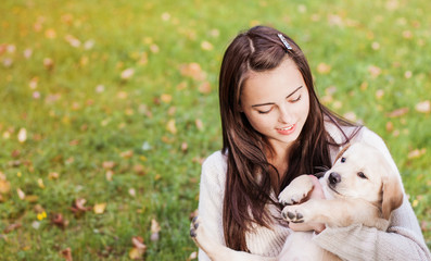 Girl with her dog resting outdoors