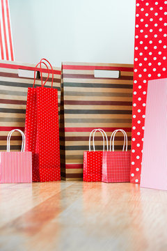 Assorted shopping and gift red paper bags - shopping and holiday