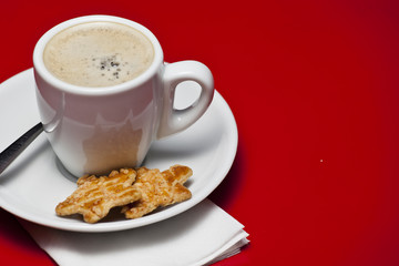 Coffee cup with biscuit