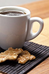 Coffee cup with biscuit