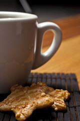 Coffee cup with biscuit