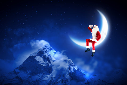 photo of santa claus sitting on the moon