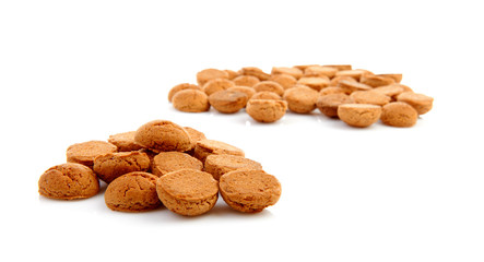 pile of ginger nuts, pepernoten isolated on white background