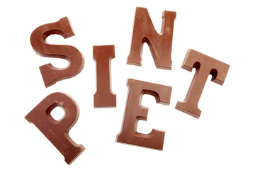 The words  SINT and PIET in chocolate letters isolated on white