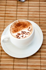 Coffee cup on a bamboo