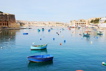 Two boats on calm water in Valetta
