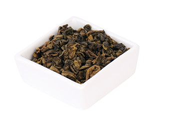 Green tea in a white porcelain dish