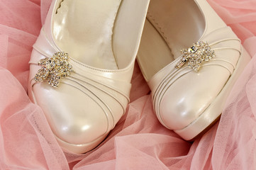 Special bridal shoes on pink tulle - wedding white shoes