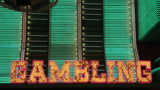 The word Gambling in neon lights