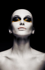 Bald futuristic woman - clean shaven head. Fashion design