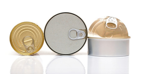 Assortment of food tin can reflected on white background
