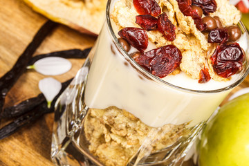 Yogurt with muesli and berries in glass