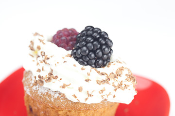 muffin with whipped cream,mint, raspberries, blackberries and nu