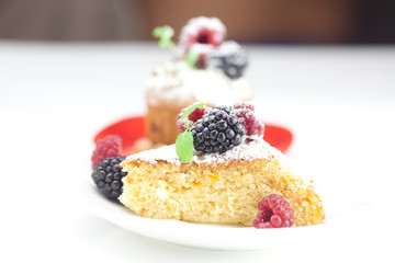 muffin with whipped cream, cake with icing, raspberry, blackberr