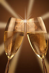 Christmas glasses of Champagne and golden background