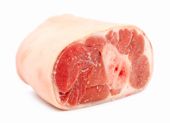Uncooked ham / gammon joint with skin on against white backgroun