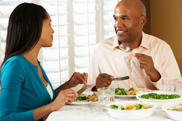 Couple Enjoying Meal At Home