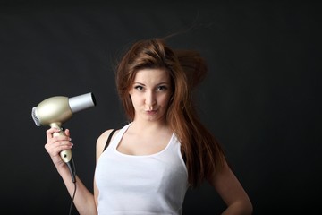young beauty with hairdryer