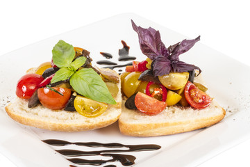 juicy tomatoes on fresh bread, pesto as topping