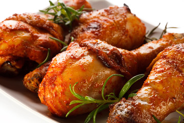 Grilled chicken legs on white background