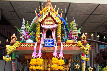 Spirit house in a garden in Thailand.