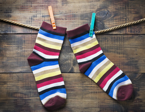 colorful socks hanging on clothespins