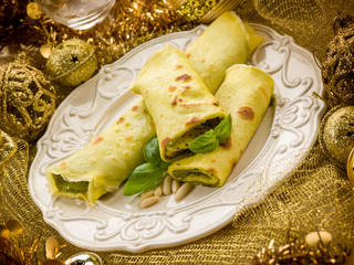 pesto crepes over golden christmas table