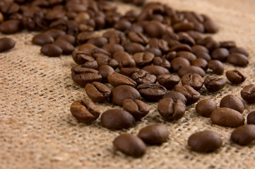 Coffee beans on burlap close up