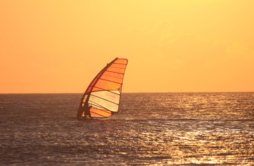 Backlit windsurfer at sunset. Tarifa, Andalusia Spain