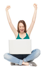 Excited woman with laptop