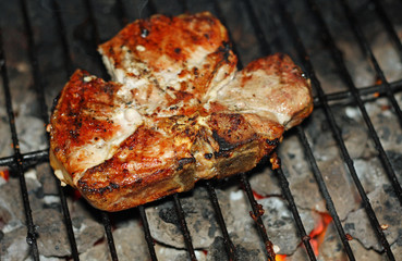 tasty steak barbecued over the barbecue