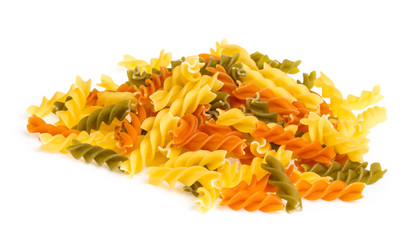 Uncooked pasta fusilli in different colours, white background