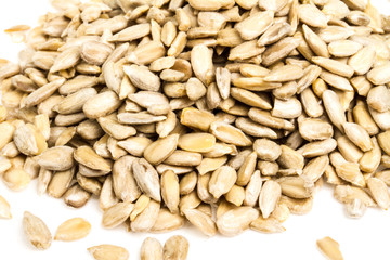fresh sunflower seeds isolated on a white background