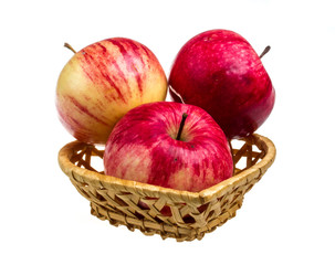 fresh red apples in the dish isolated on white background