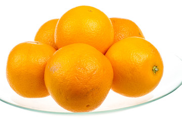 Heap of oranges in the dish