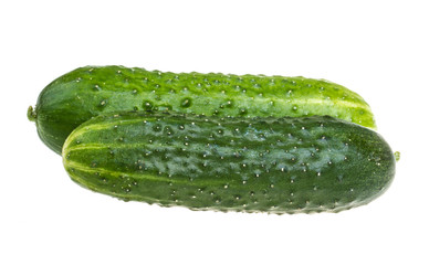 Healthy food. The green cucumbers isolated on white background