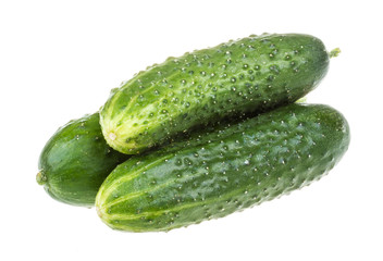 Healthy food. The green cucumbers isolated on white background