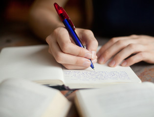 Education abstract, Woman hands writing in notepad