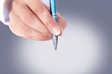 Hand holding pen