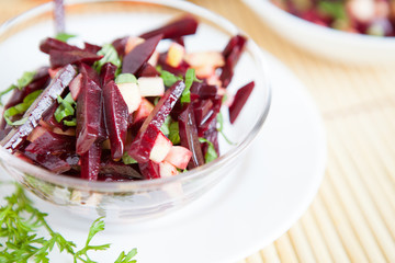 Salad of boiled beets and apples, cut into strips