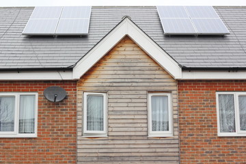Obraz premium solar energy panels on the roofs of residential homes