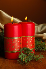 Two candles and christmas decorations,