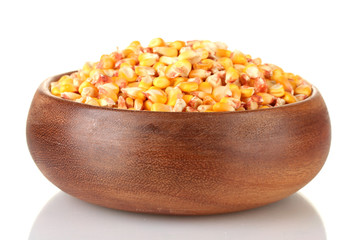 Corn in wooden bowl isolated on white